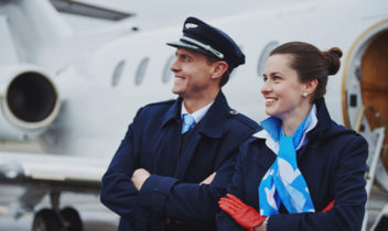 airline crew next to a plane 