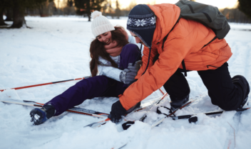 person with broken leg getting help