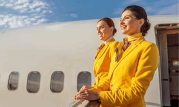 airline crew standing next to a plane 